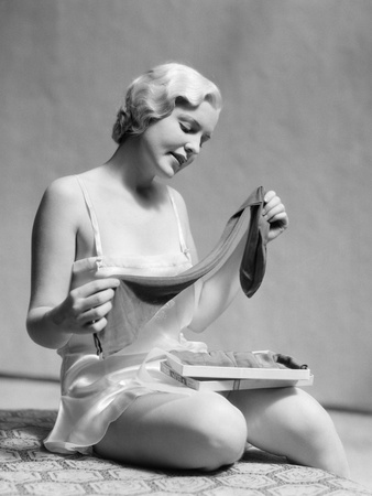 Lady in 1930s Silk Teddy Opening Stockings