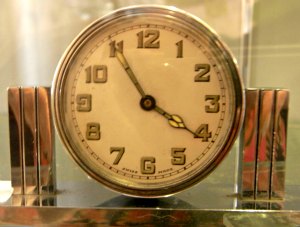 Chrome clock with deco pillars on either side