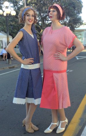 Girls wearing Blue and red 1920s style dresses with Mary Janes