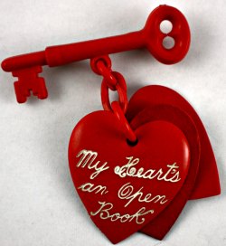 Red Valentine Heart Pin Dangling from a Key