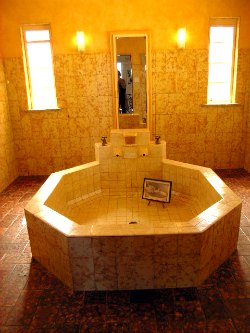 Huge Octagonal Bath Everglades Bathroom, a huge peach coloured bath