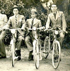 1930s Mens Fashion. Three men on bicycles