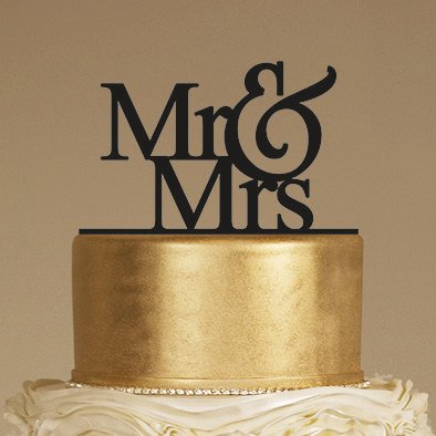 Mr & Mrs Wedding Cake Topper on a Gold Cake