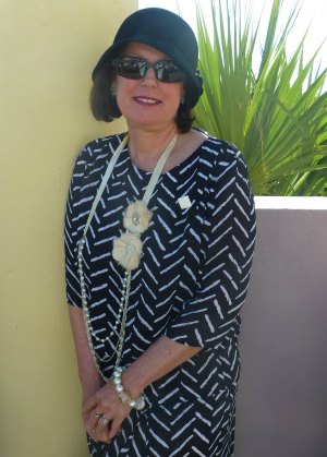 Lady in Navy Blue and White Dress, Cloche Hat and Beads